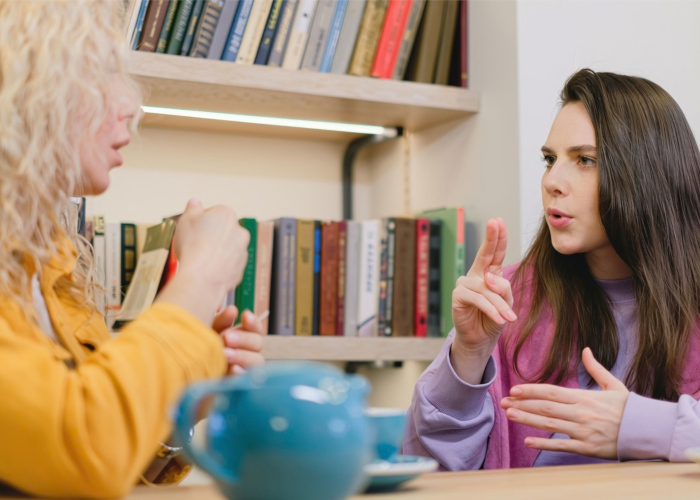 Two women talking.
